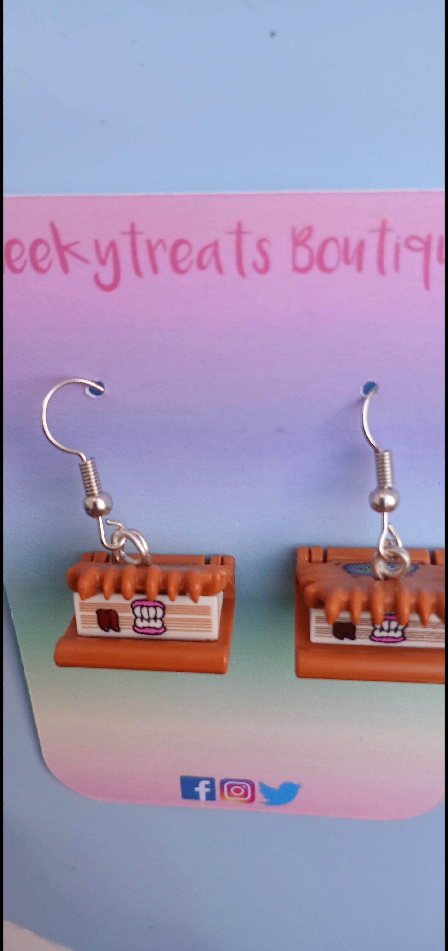 Book of monsters novelty earrings