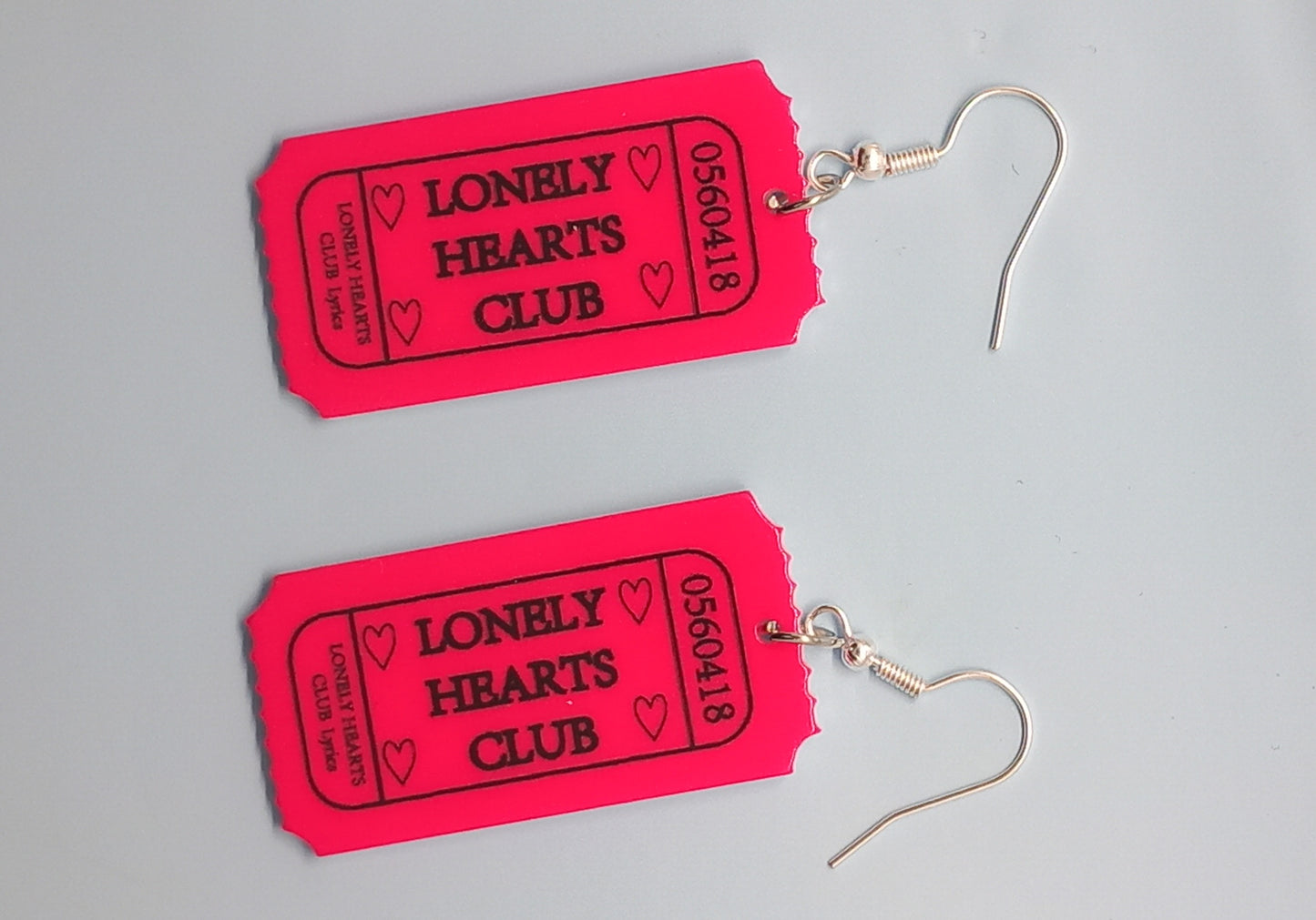 Pink lonely hearts club earrings
